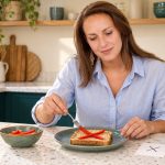 7 Styles of Rune Healing: Modern Practices and Safer Choices Woman arranging red pepper strips into an X on toast beside a separate paper symbol card